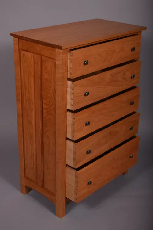 Each drawer is held together with hand-cut dovetails. Drawer sides are built with Butternut.