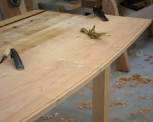 The headboard under construction. Hand cut beading tools provide a personal touch.