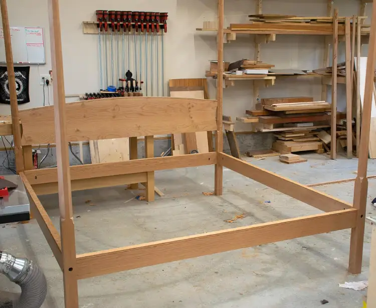 A bed in the shop during the dry-fitting stage of construction